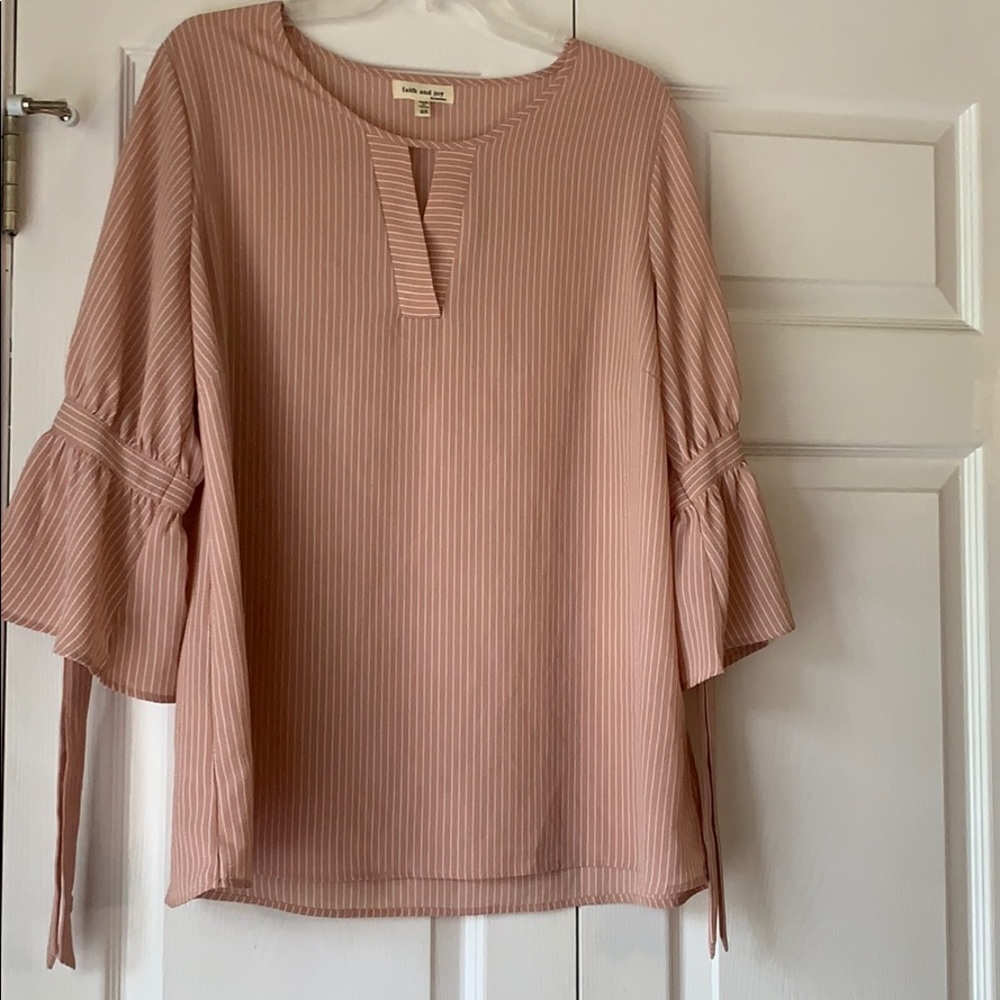 Pink and white striped bell-sleeve top.